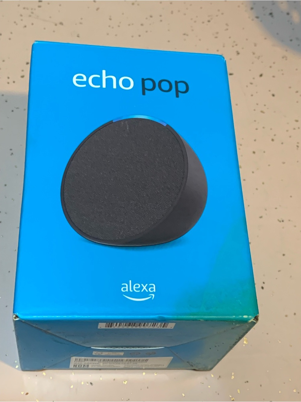 Amazon Echo Pop smart speaker in charcoal black, featuring Alexa voice control